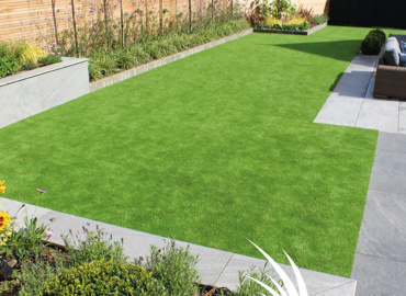 Artificial Grass With Porcelain Tiles on the walls